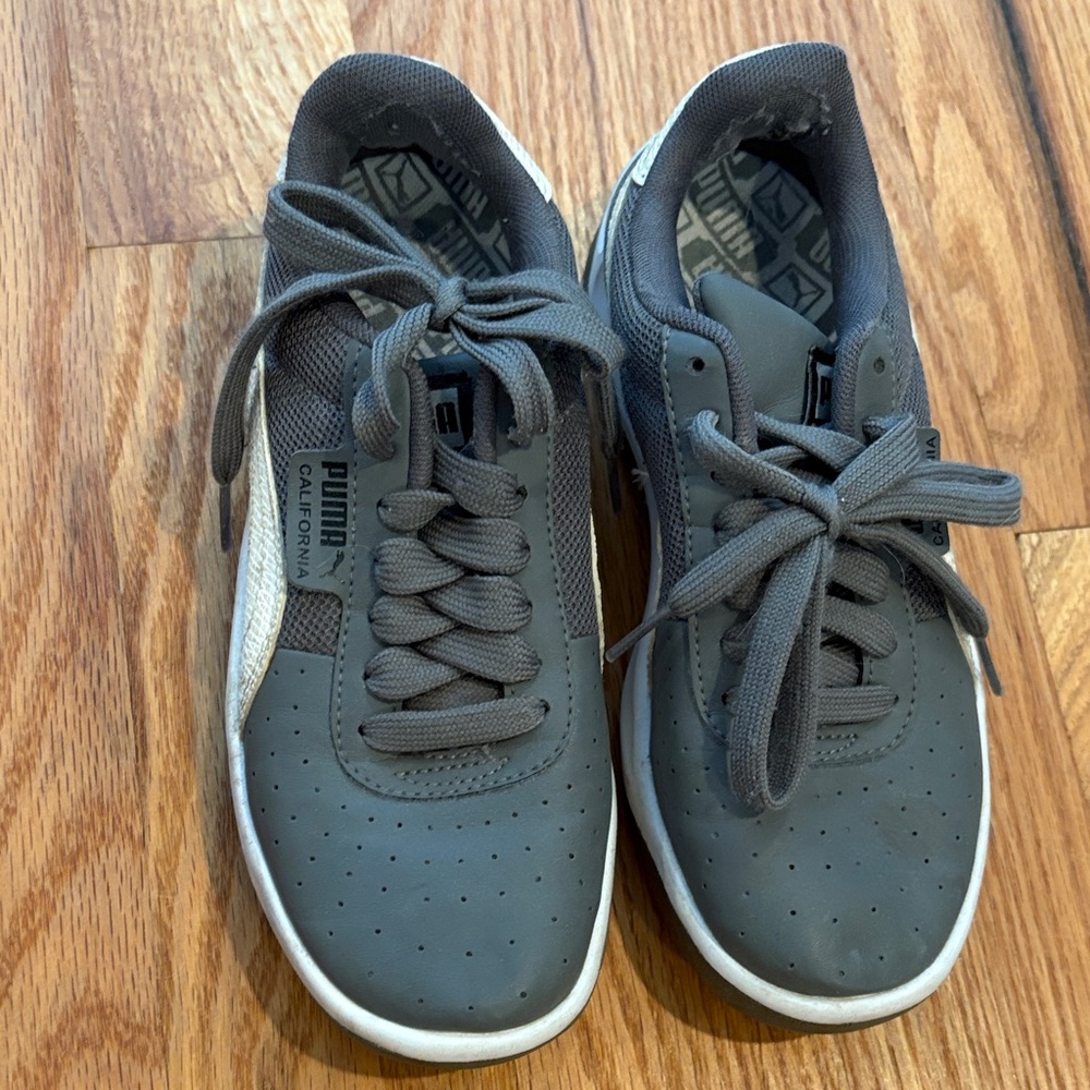 Puma women’s Charcoal and White Sneakers